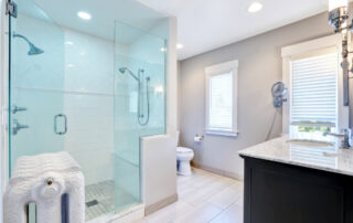 Hinged Shower Door in bright bathroom.