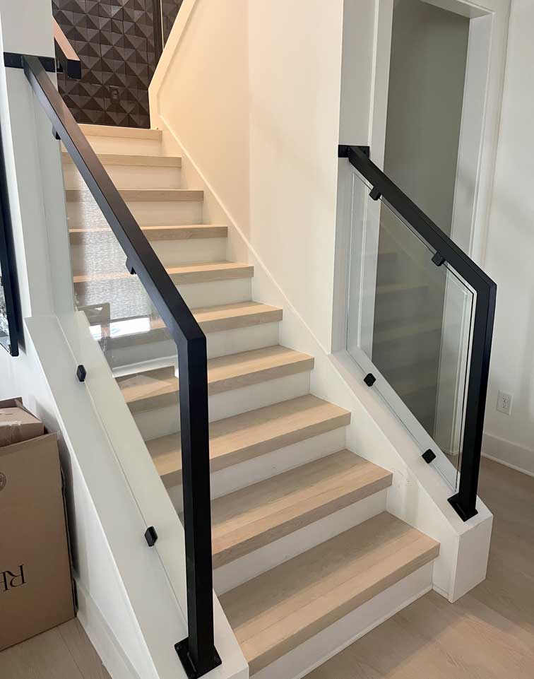 Custom glass railings on staircase in customer's home, Clarksville, TN.